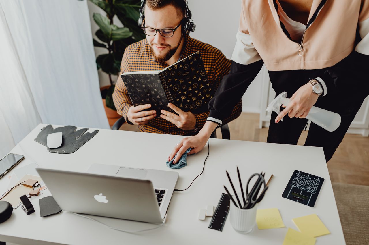 services-02 Colleagues interact in a modern office setting, blending technology with workplace hygiene.